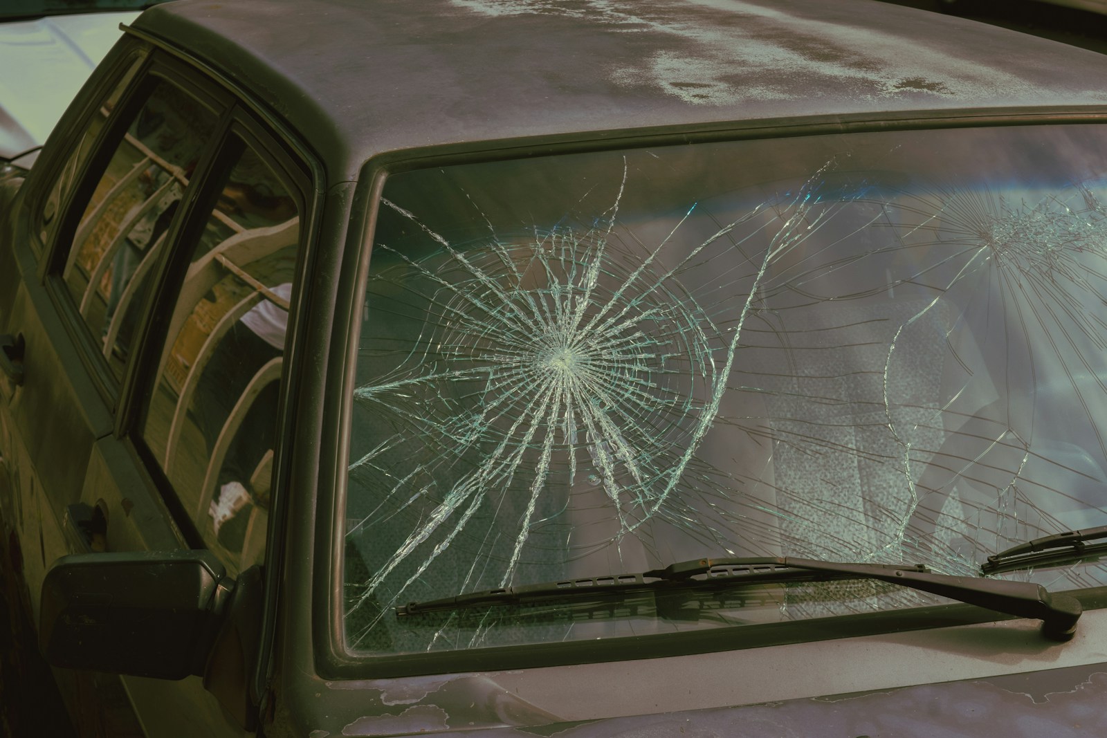 Photo by Gohar Khachatryan A broken windshield of a car with a broken windshield